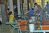 Students blowing glass