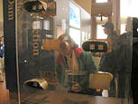 At the Johnstown Flood Museum, a visitor examines photographs of Johnstown residents from 1889.